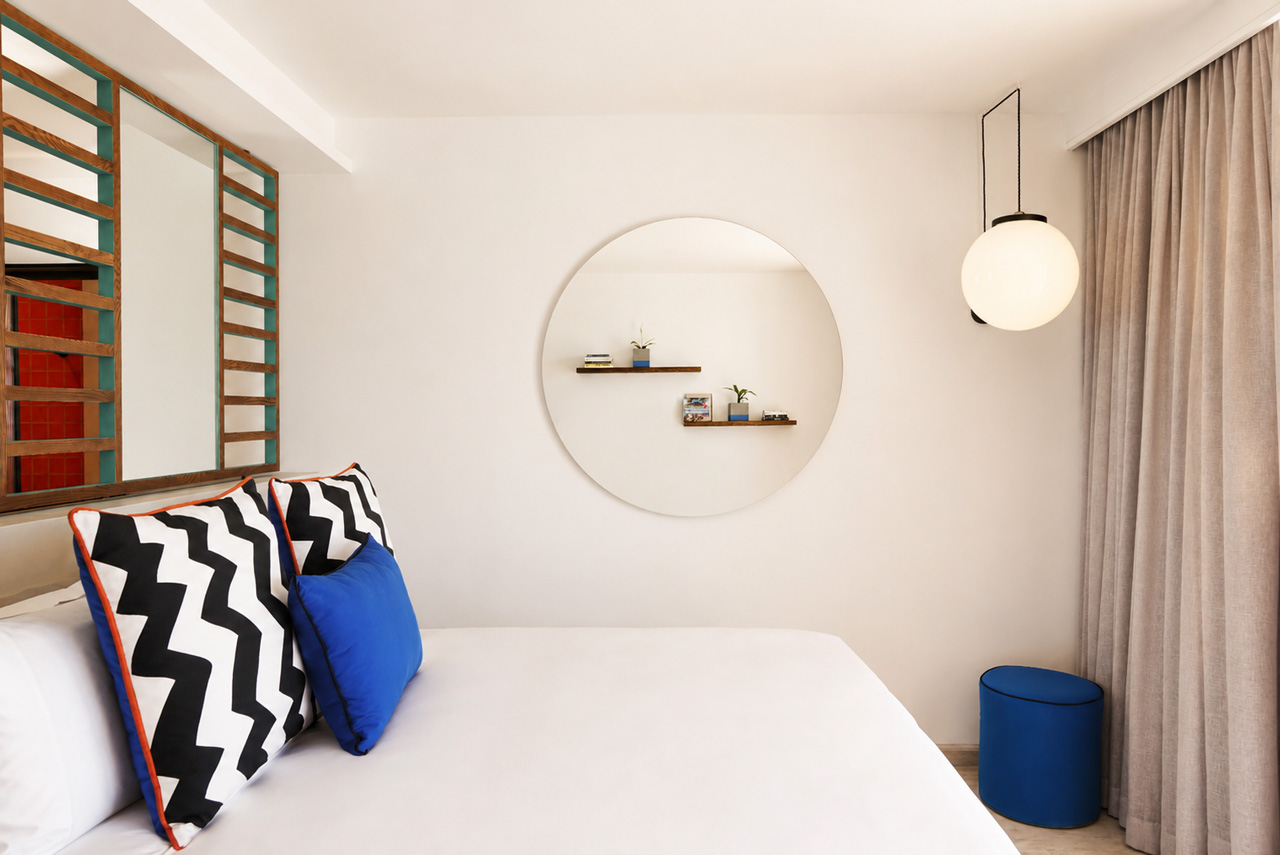Bright Bang on Beach bedroom with natural linens and colourful design details.