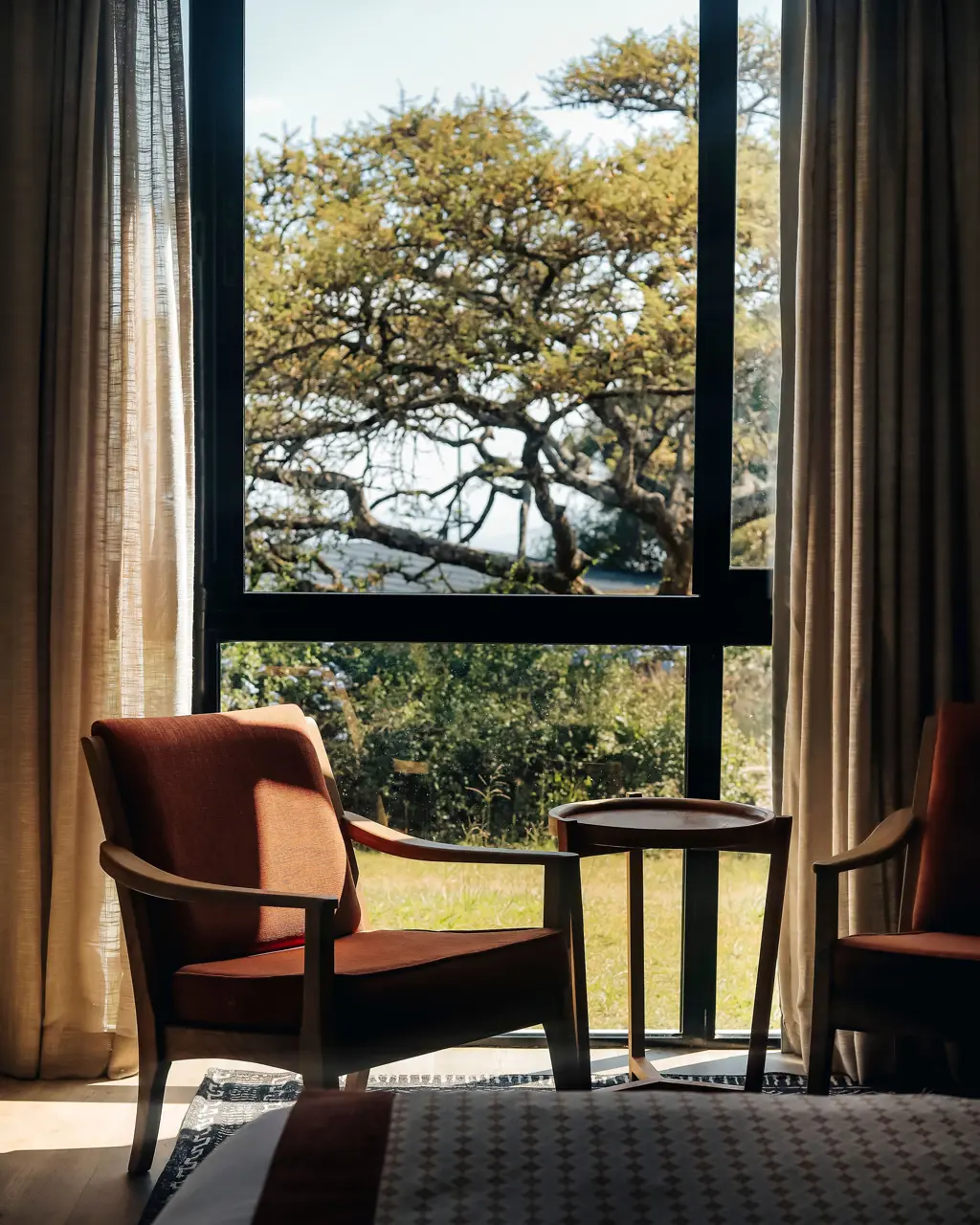 Garden View Room seating area overlooking the greenery.